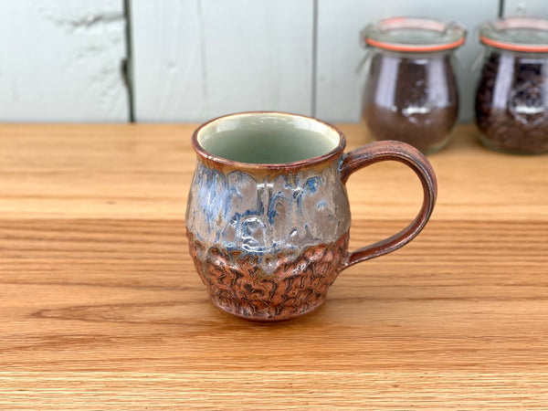 Copper Handle and Rim Carved Mug