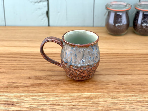 Copper Handle and Rim Carved Mug